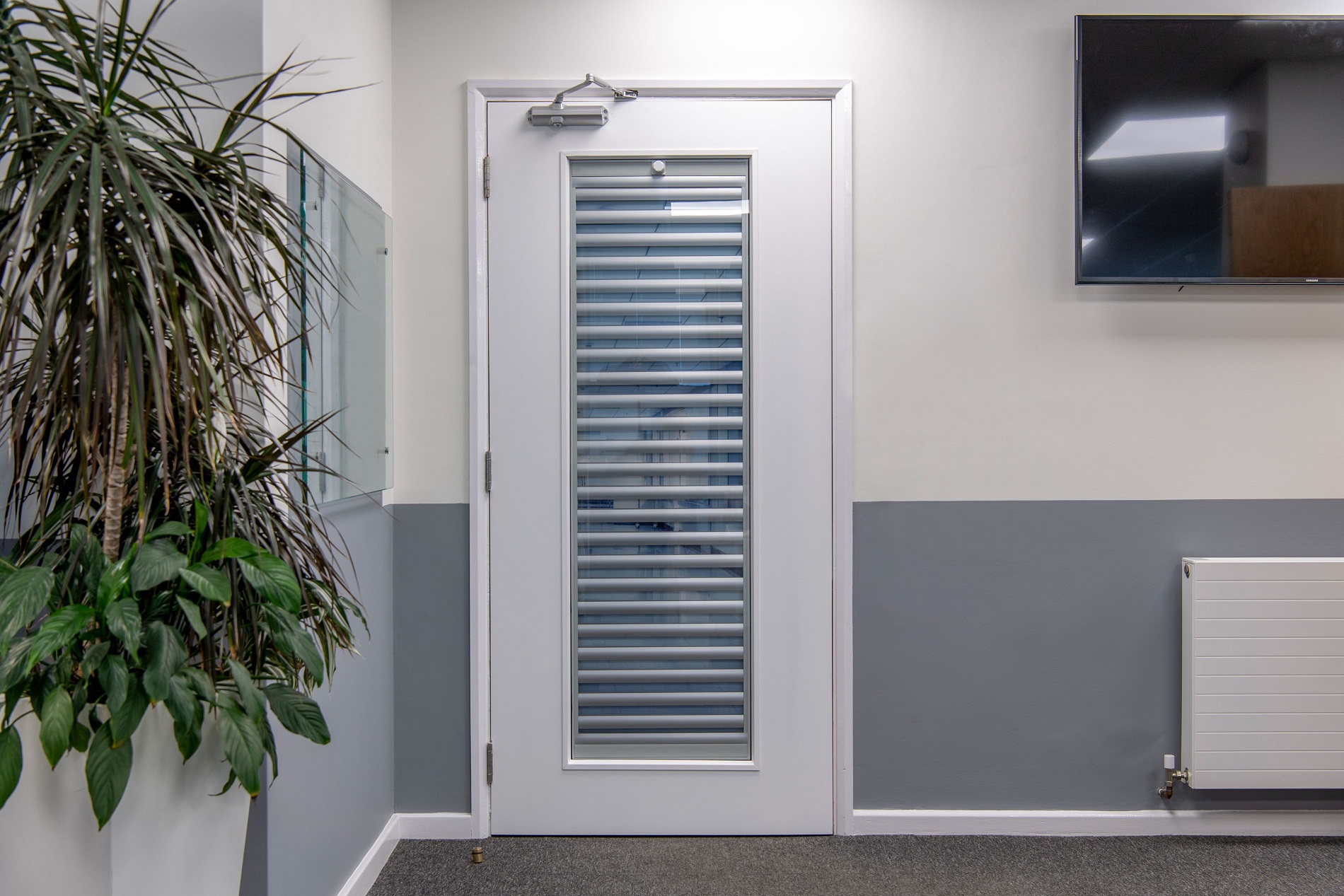 What is the best type of window blind for a hospital or healthcare building?