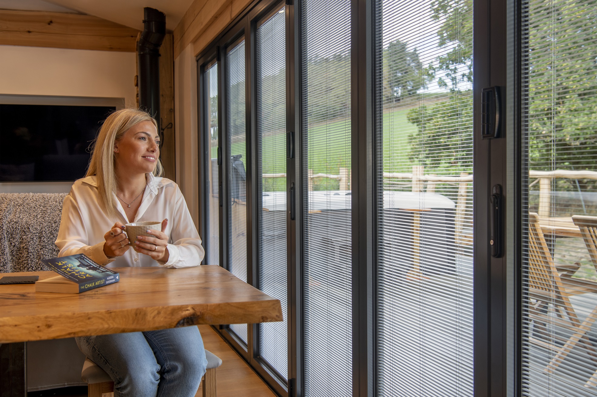 Integral blinds fitted into bi-fold doors of a holiday home.